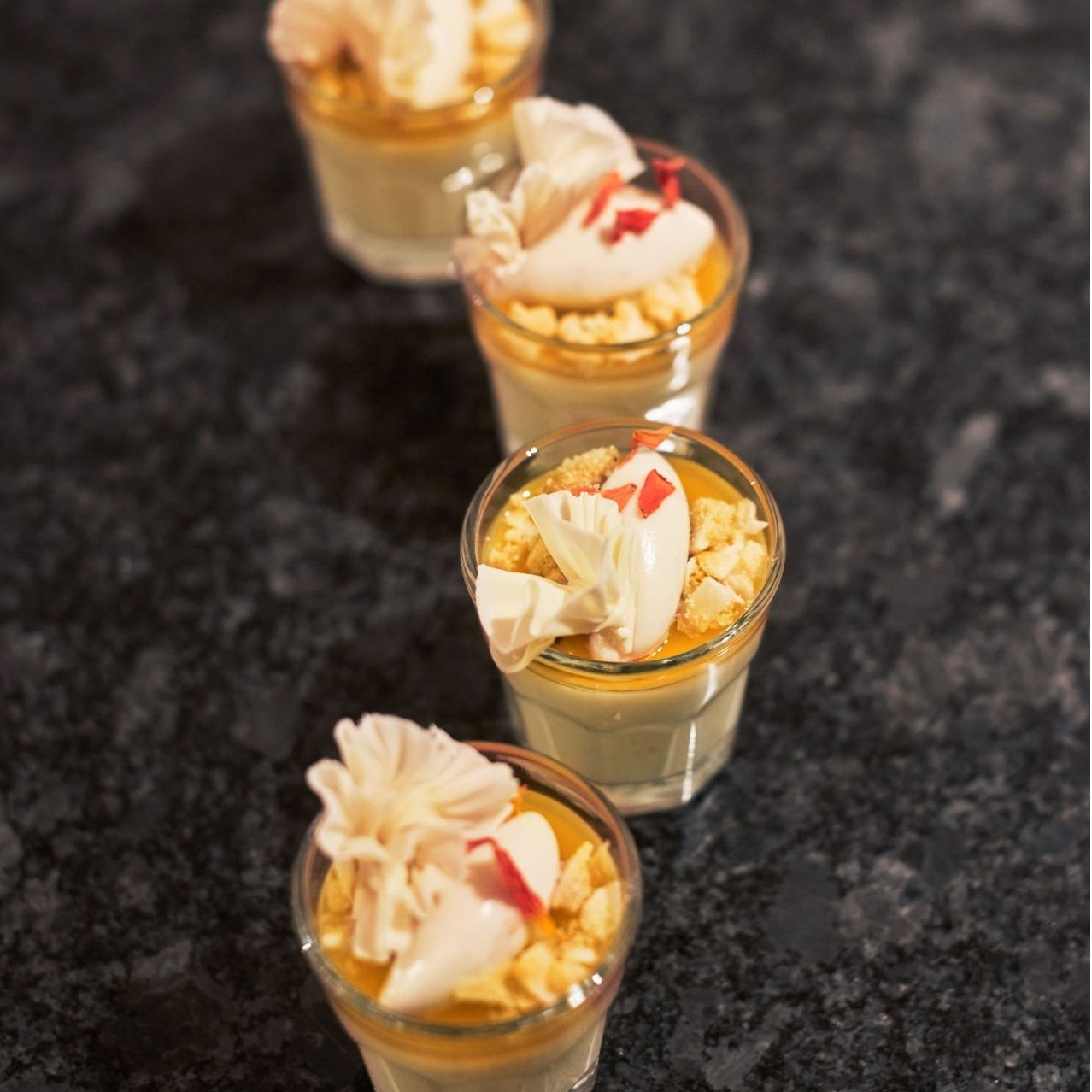 Passion Fruit Posset topped with White Chocolate & Coconut Whipped Ganache